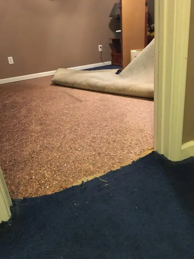 Carpet pad removal revealing water damage during Drying & Dehumidification in Hacienda Heights